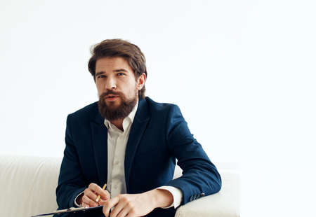 Business man in shirt and jacket on a light background business finance modelの写真素材
