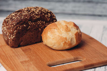loaf of bread on a wooden board powerful products foodの写真素材