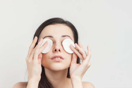 pretty brunette naked shoulders sponge in hand cosmeticsの写真素材