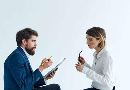 Emotional woman and young man communication on a light background psychology understandingの写真素材