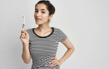 woman holding face dental problems pain dissatisfaction