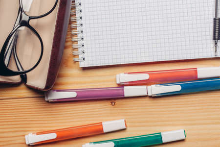 glasses in case stationery wooden work desk office close-upの写真素材