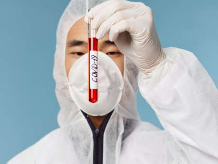 male laboratory assistant asian appearance blood test research examination close-up