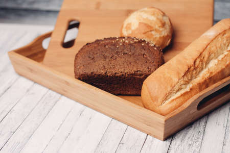 whole grain bread loaves homemade cakes cooking wood board close-up