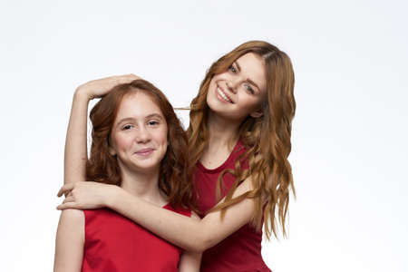 mom and daughter fashionable clothes friendship family close-upの写真素材