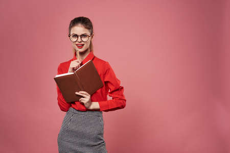 Woman in red shirt notepad documents secretary professionalsの写真素材