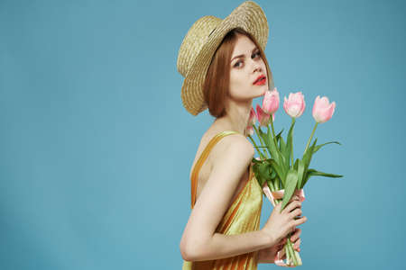 pretty woman with hat flowers gift womens day funの写真素材