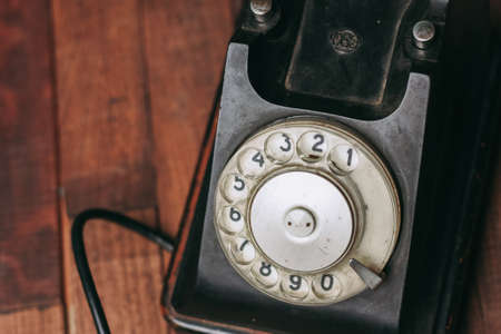 retro telephone black on a wooden floor classicの写真素材