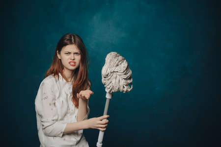 woman mop on blue background gestures with hands emotions Copy Spaceの写真素材