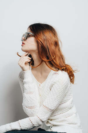 cute redhead woman white sweater fashion glamor cropped viewの写真素材