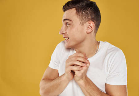 Man laughs on a yellow background Delight emotions joy modelの写真素材