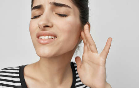 woman holding face health problems teeth pain medicine