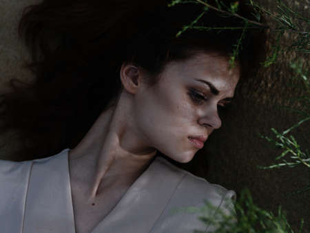 Pretty woman lies on the sand resting fresh air summerの写真素材