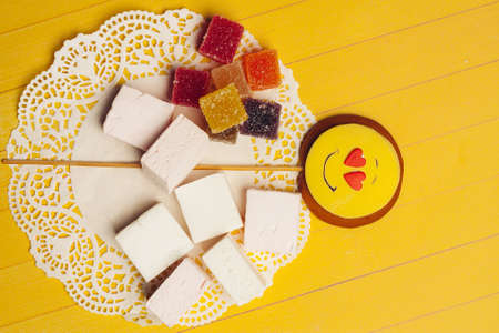 colorful marmalade candy sweets dessert enjoyment yellow backgroundの写真素材