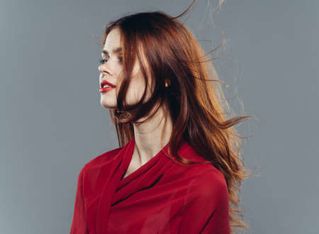 pretty woman in red red shirt glamor bright makeup fashionの写真素材