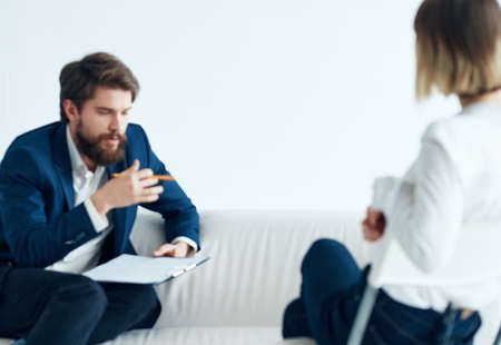Employees communicate on a light background woman vacanciesの写真素材