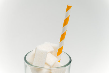 sugar cubes in a glass with a straw calories cocktail glucose sweetsの写真素材
