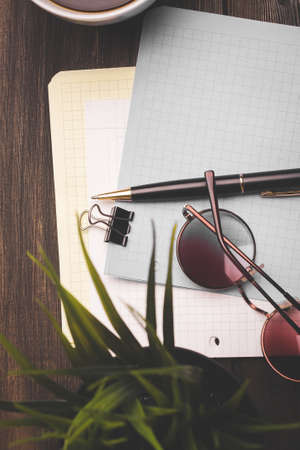 stationery notepads glasses paper with clip coffee cup flowerの写真素材