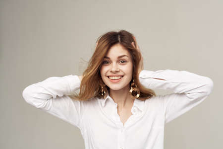 Cheerful woman attractive look emotions shirt studio elegant styleの写真素材