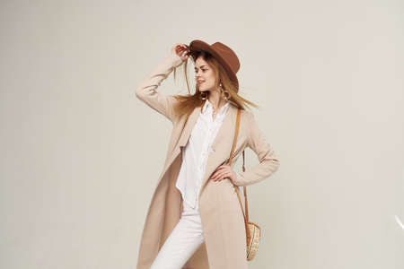 elegant woman with hat fashion attractive look style light backgroundの写真素材