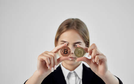 emotional woman with calculator cryptocurrency bitcoin financialの写真素材