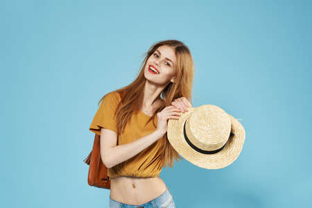 beautiful woman fashionable summer clothes backpack studioの写真素材