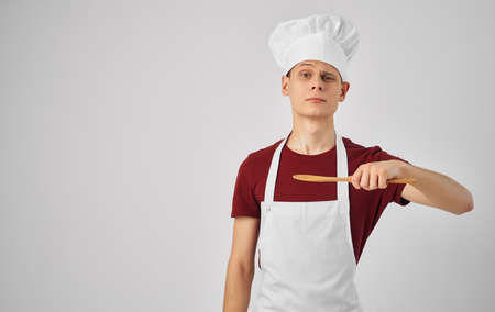 male chef with kitchen utensils cooking food serviceの写真素材