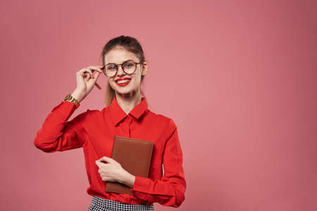 Business woman red shirt office finance pink background