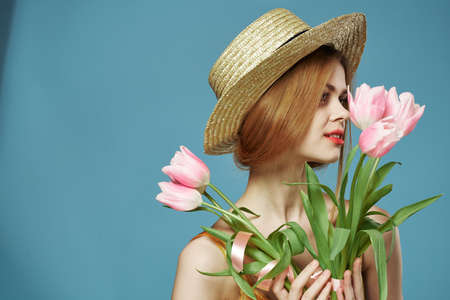 woman bouquet flowers luxury holiday gift blue backgroundの写真素材