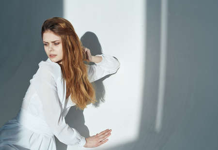 Woman in black clothes premise red hair cropped viewの写真素材