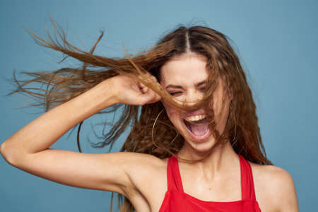 Attractive woman wavy hair charming look cosmetics elegant style blue background