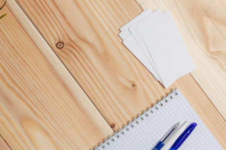 notepad pen desk wooden background office object Copy Spaceの写真素材
