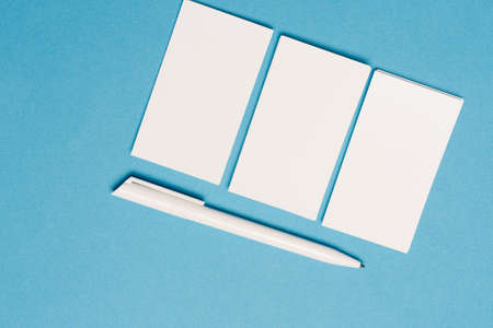 white business cards mockup placed randomly on the office deskの写真素材