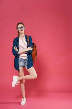 Pretty woman fashionable clothes fun pink background emotions