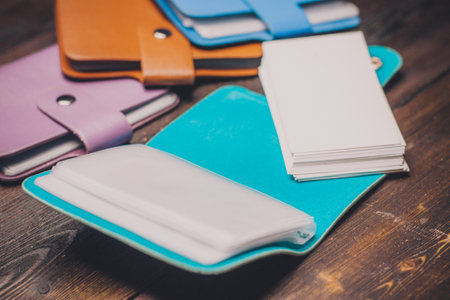 different color business card holders credit card storage accessories wooden table