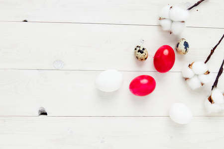 willow branch Easter eggs on a wooden table Copy Spaceの写真素材