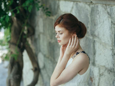 Cheerful attractive woman luxury model outdoors charmの写真素材