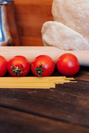 italian pasta on a wooden table cherry tomatoes cooking lunch