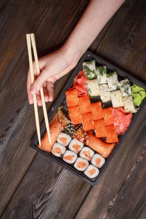set sushi rolls delicacy wooden sticks top view japanese cuisineの写真素材