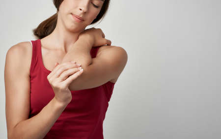 woman in red t shirt health problems pain dissatisfaction