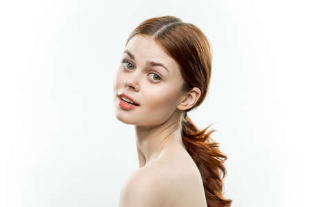 pretty woman naked shoulders cosmetics face glamor smileの写真素材