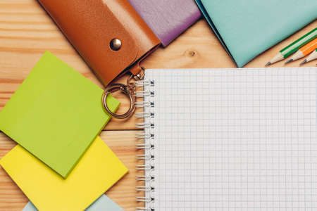 colorful paper notepads felt-tip pens stationery office wooden table