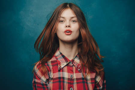 attractive woman cropped view plaid shirt studio modelの写真素材