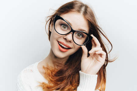 woman with glasses fashion smile cosmetics studio emotionの写真素材