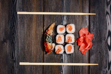 set of sushi and rolls wooden sticks top view ginger wasabiの写真素材
