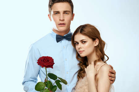 Cute young couple hug rose date luxury charm