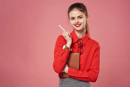 woman in red shirt secretary job official office financeの写真素材
