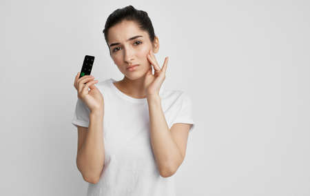 woman in white t-shirt pills health problems medicine treatment