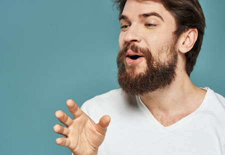 Happy man joy delight emotions blue background thick beardの写真素材