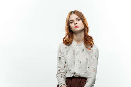 red-haired woman with a round lollipop in her hands emotions joy sweets candyの写真素材